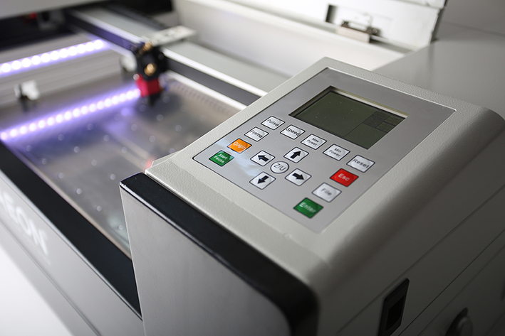 view of the control panel and laser bed on the MIRA5Legacy model