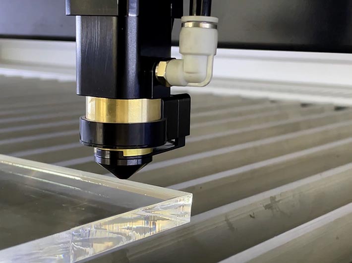 close up of the laser head on the Aeon Super NOVA CO2 Laser Engraver and Cutting Machine